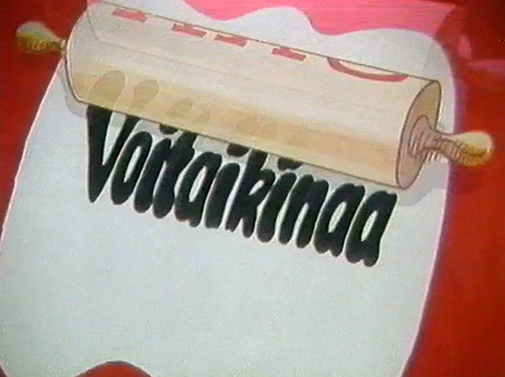 Kaulin jatkaa matkaansa taikinamuodon yli, ja kirjaimet venyvät sen alla