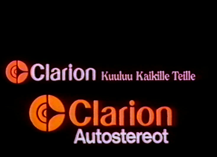 A flat white car in profile trails motion streaks, headlamp flaring, Clarion mark above.