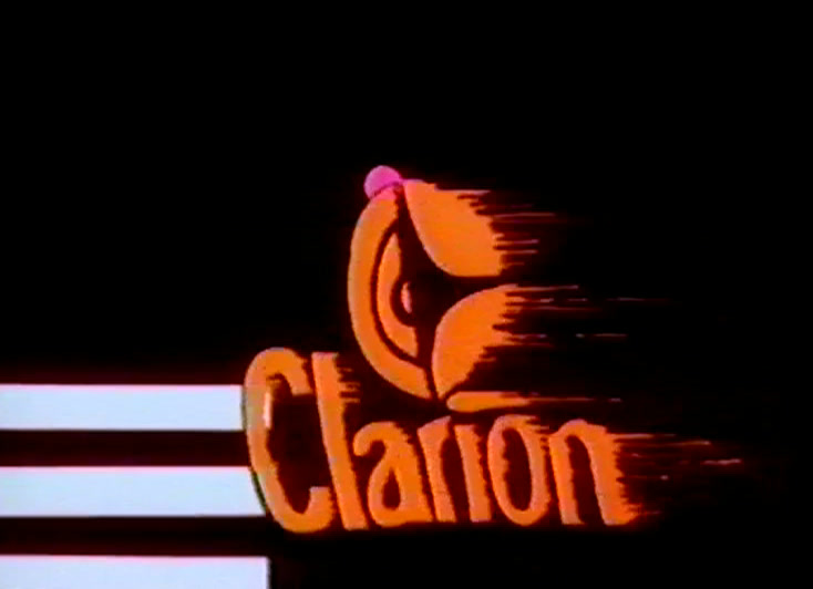 A pink dot hangs above the roundel, three white bars at the left edge.