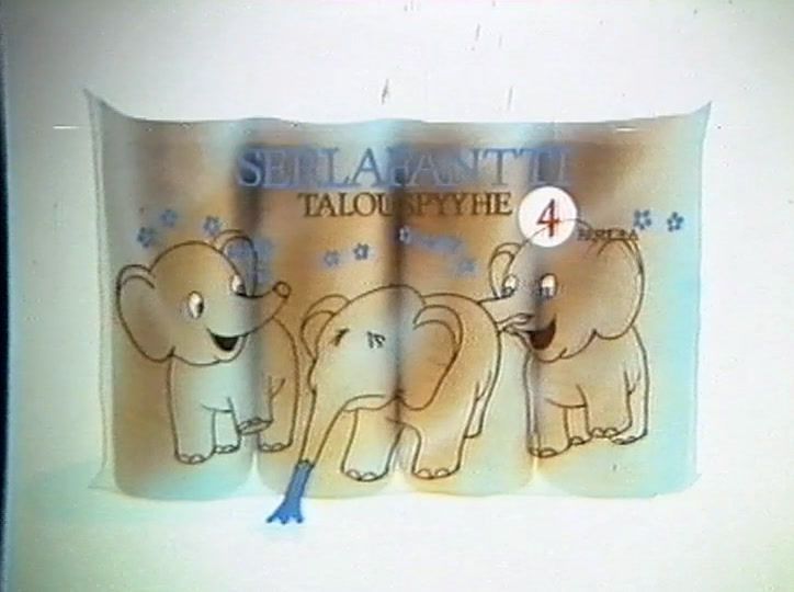 The pack lettering shows above the elephants, one trunk down where the puddle was.