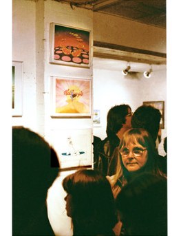 Marjut Rimminen at the Neal Street Gallery in 1981, with framed Vivante and Kellogg artwork on the wall behind her