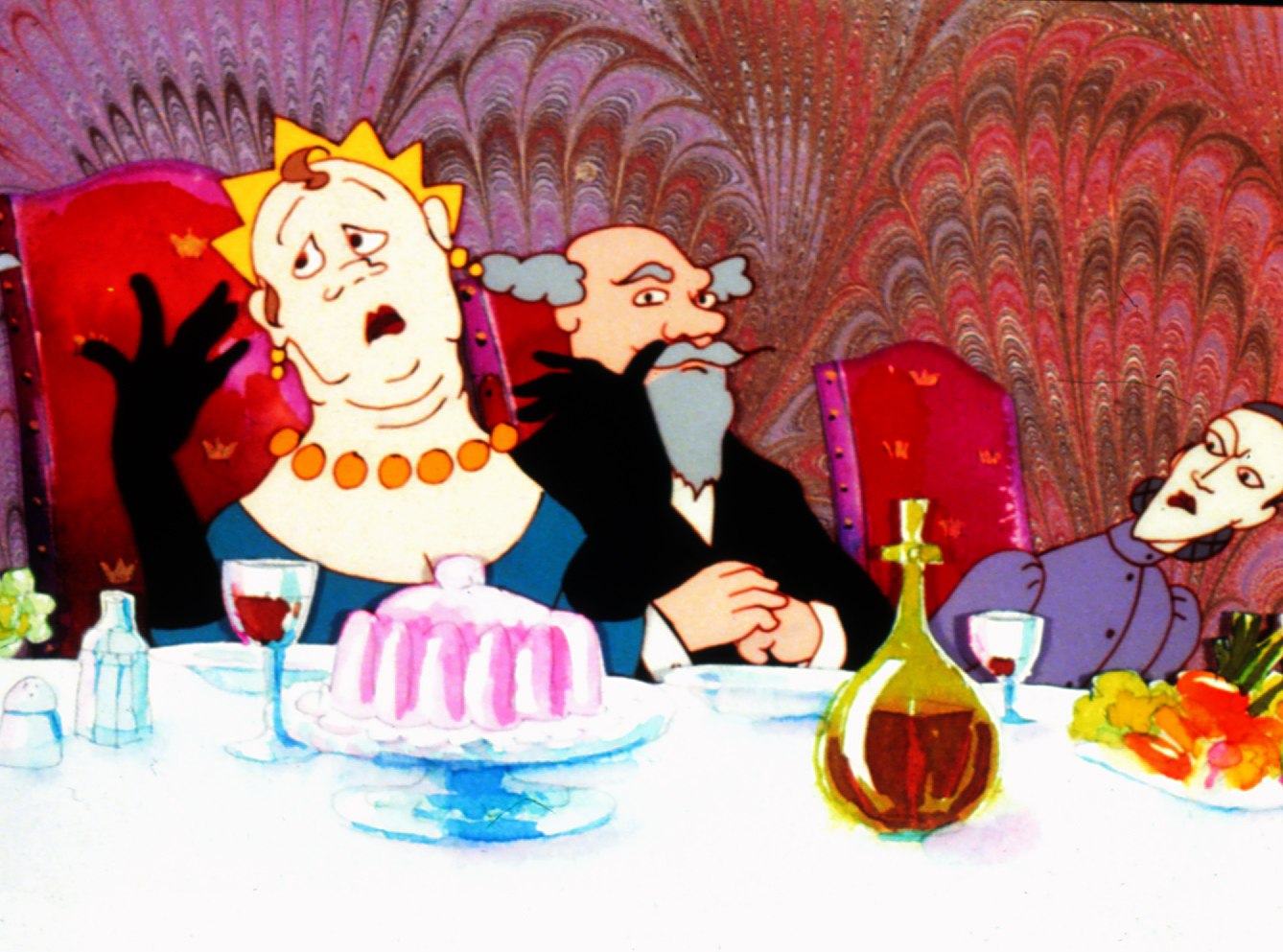 Still from The Frog King, a crowned woman raises her black-gloved hands beside two men at a banquet table