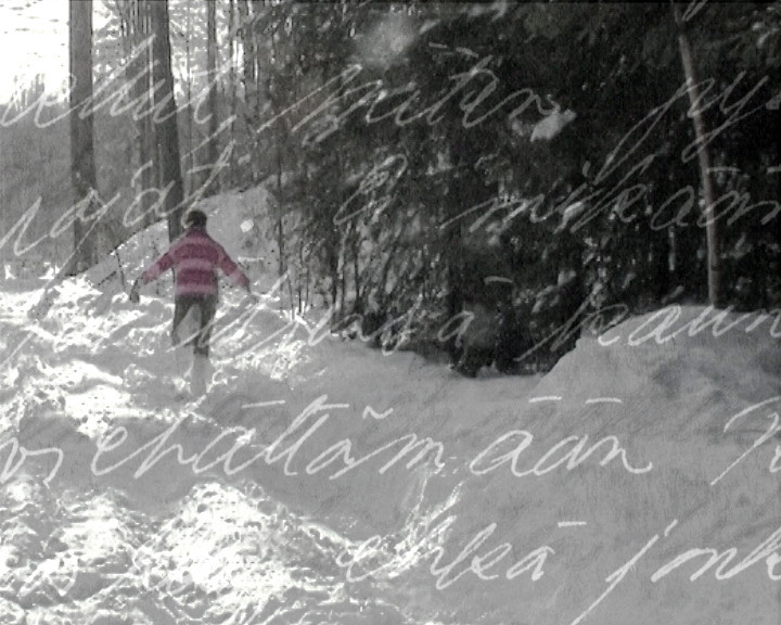 Still from Learned by Heart, figure walking in snow with handwritten text
